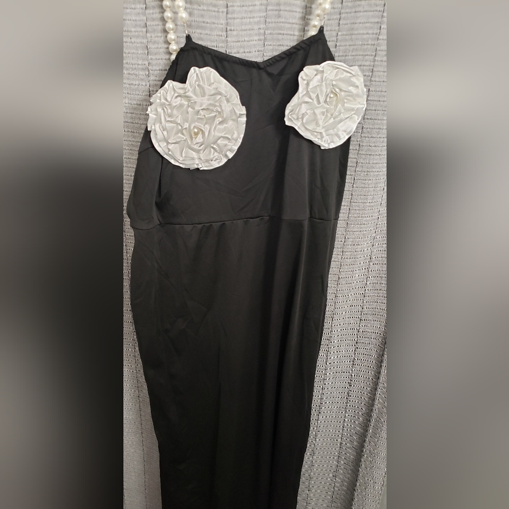 New Black Evening Gown adorned with cream/off white flowers at the bust. Size 3X